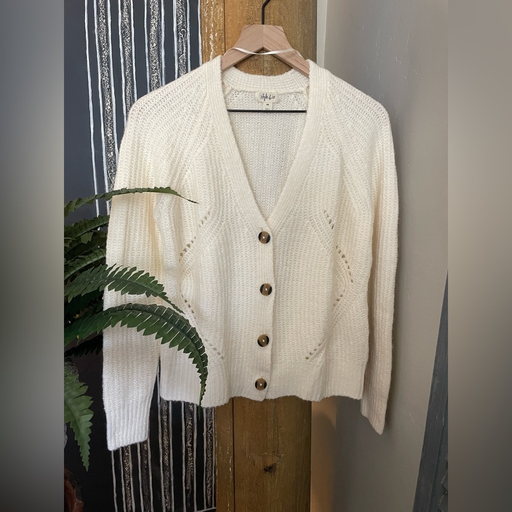 Lovely new creamy colored cardigan in size PM